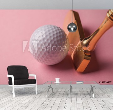 Picture of Head of luxury golden golf club near golf ball on pink background